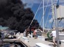 Sailboat on our dock: This 44ft catamaran  caught on fire. Probably an electrical  problem. Three people and a puppy got off safely . Fortunately , the boat was  on the T-head , wind was light and directed away from th other boats.  ( photo taken from our boat)
